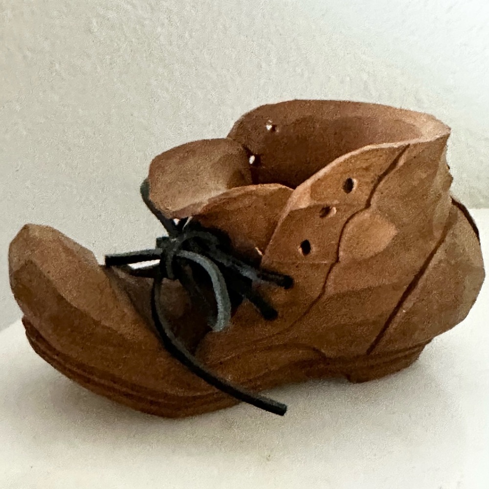 Vintage hand carved wooden boots